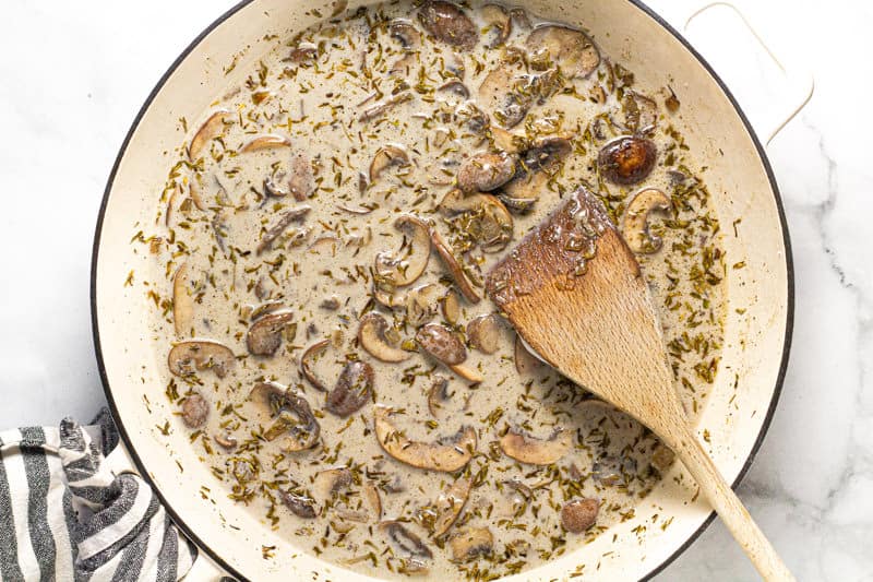 Large white pan with creamy vegan mushroom stroganoff in it