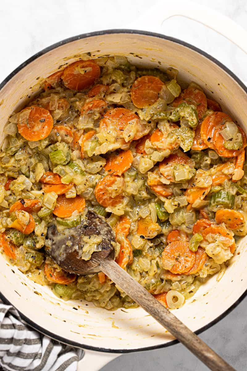 Large pot filled with sautéed veggies coated in flour and butter