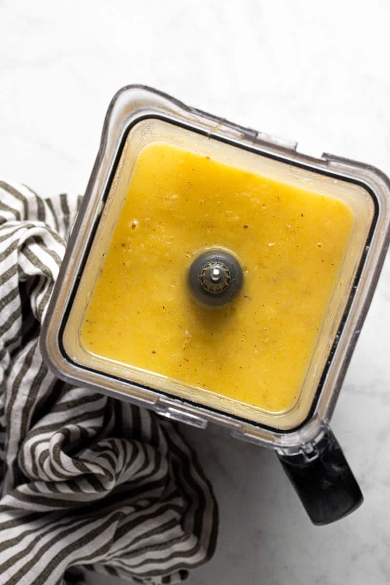 Blender pitcher with homemade blended potato leek soup