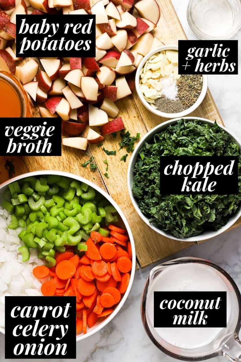 White marble counter top with ingredients to make vegan potato kale soup