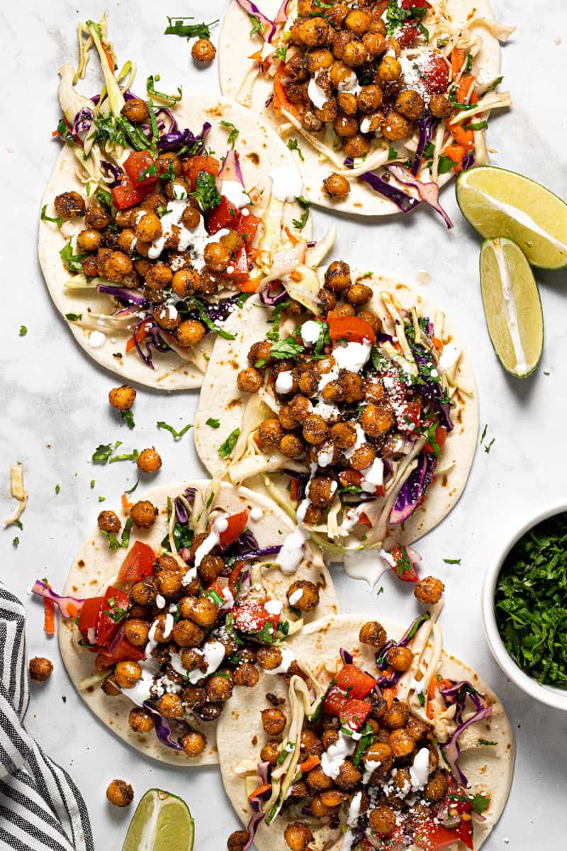 White marble counter top with homemade chickpea tacos with slaw