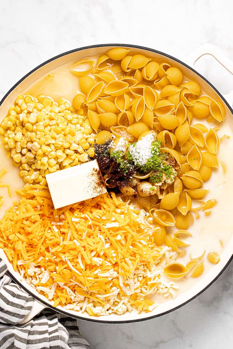 Large white pan filled with ingredients to make one pot mac and cheese