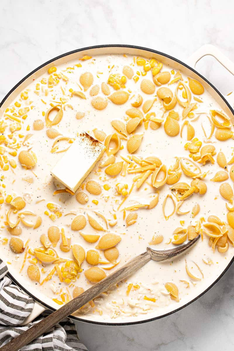 Large white pan filled with ingredients to make one pot mac and cheese