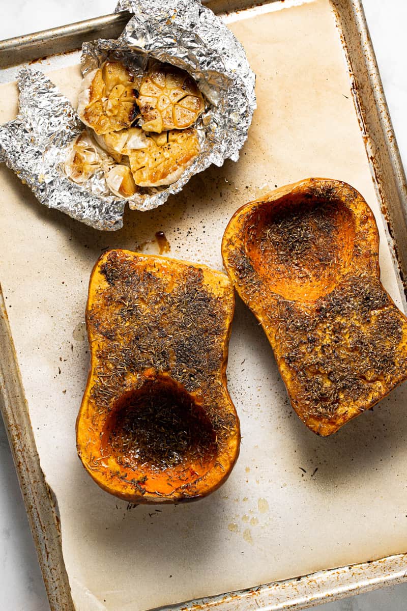 Baking sheet with roasted squash and garlic