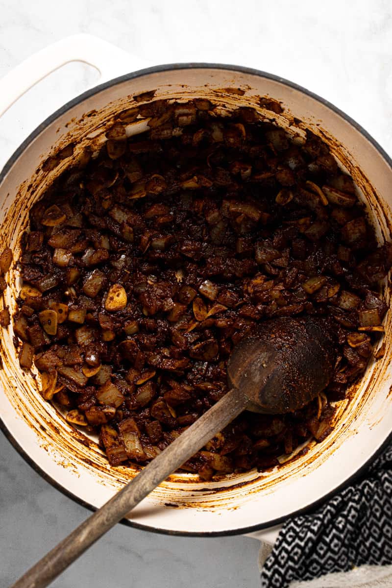Large pot filled with ingredients to make 3 bean vegan chili