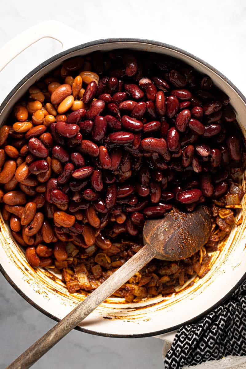 Large pot filled with ingredients to make 3 bean vegan chili