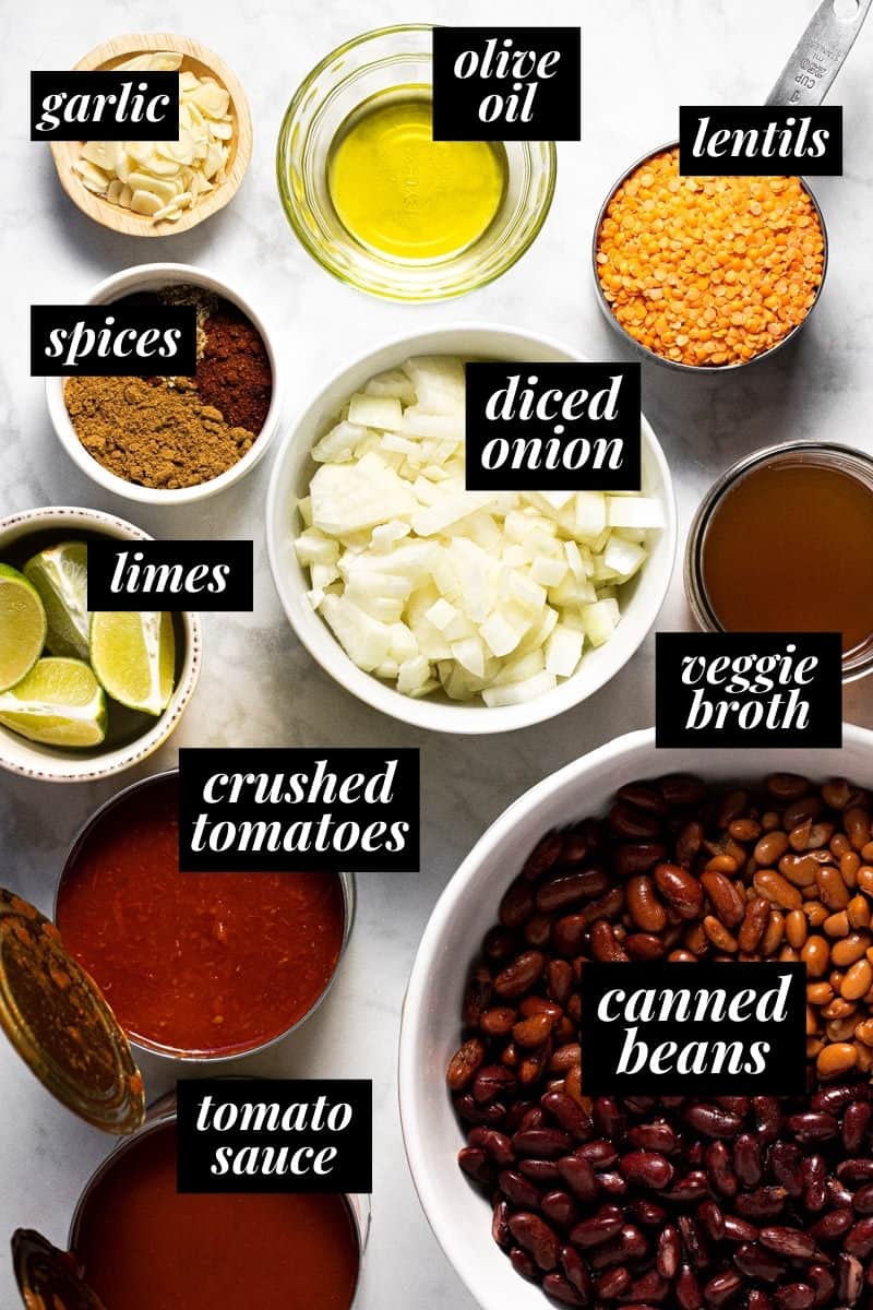 White marble counter top with ingredients to make vegan lentil chili 