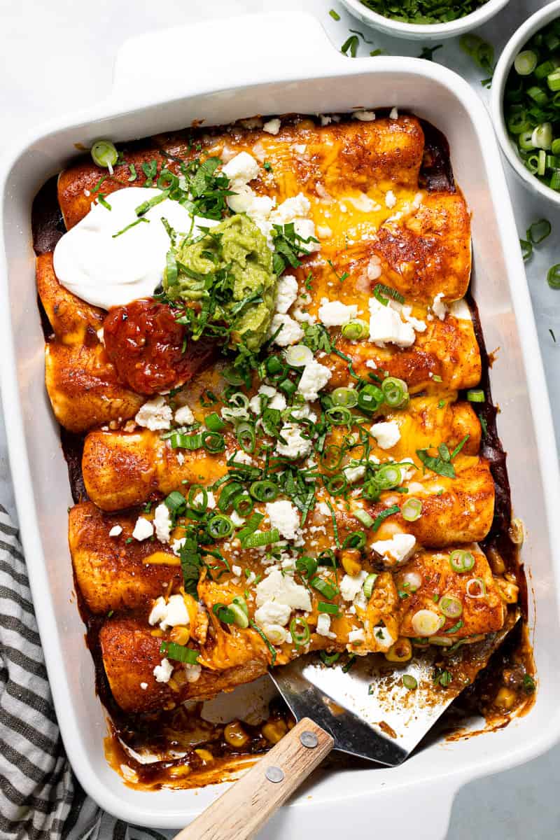 Large white baking dish filled with homemade black bean enchiladas