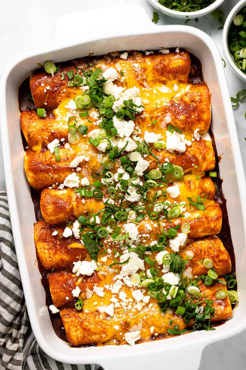 Large white baking dish filled with homemade black bean enchiladas