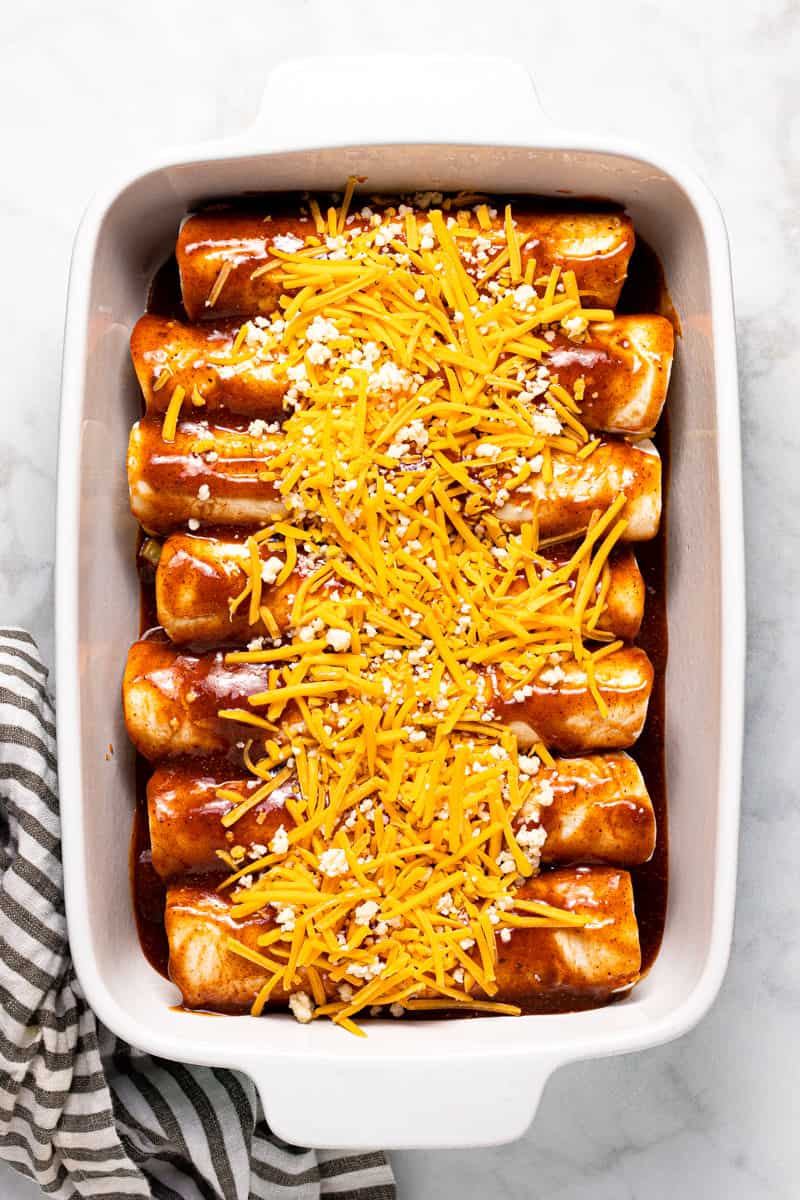 Large white baking dish filled with homemade black bean enchiladas