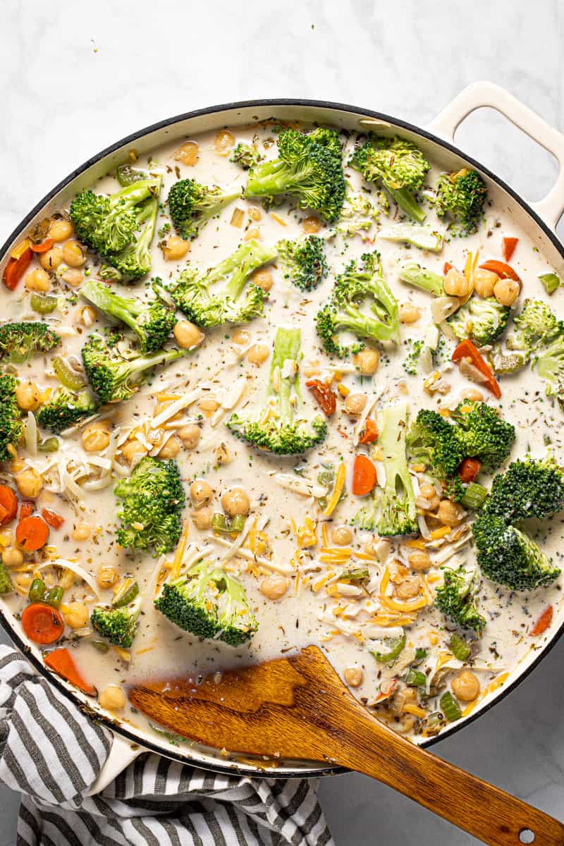 Photos showing step by step how to make one pan chickpeas and rice with broccoli