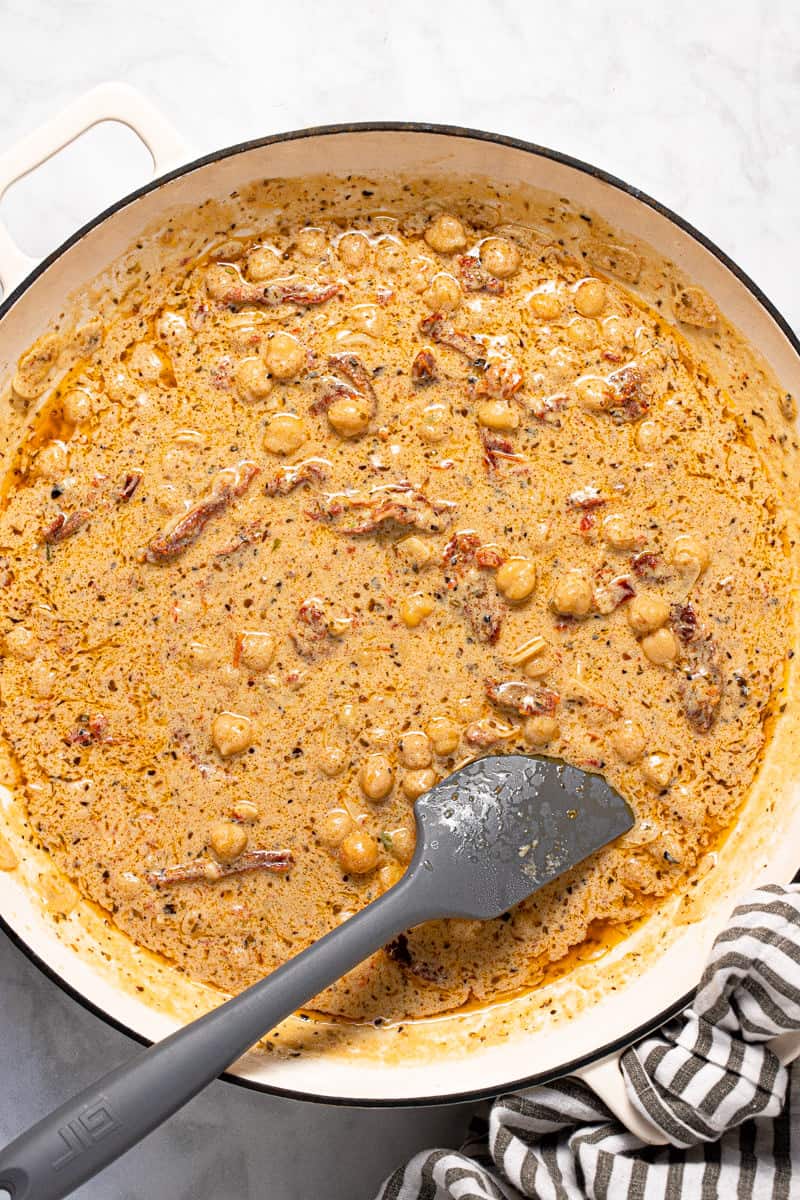 Photos showing step by step how to make creamy vegan Tuscan pasta
