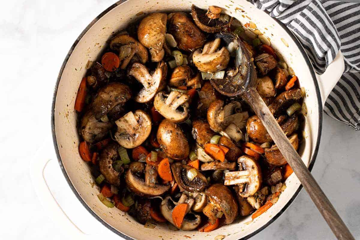 Large white pot filled with ingredients to make easy vegan stew