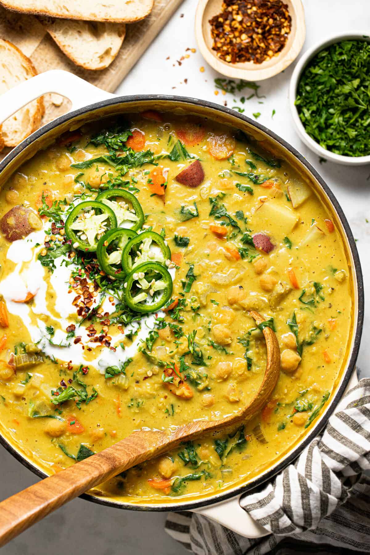 Large pot of creamy vegan chickpea stew with potatoes