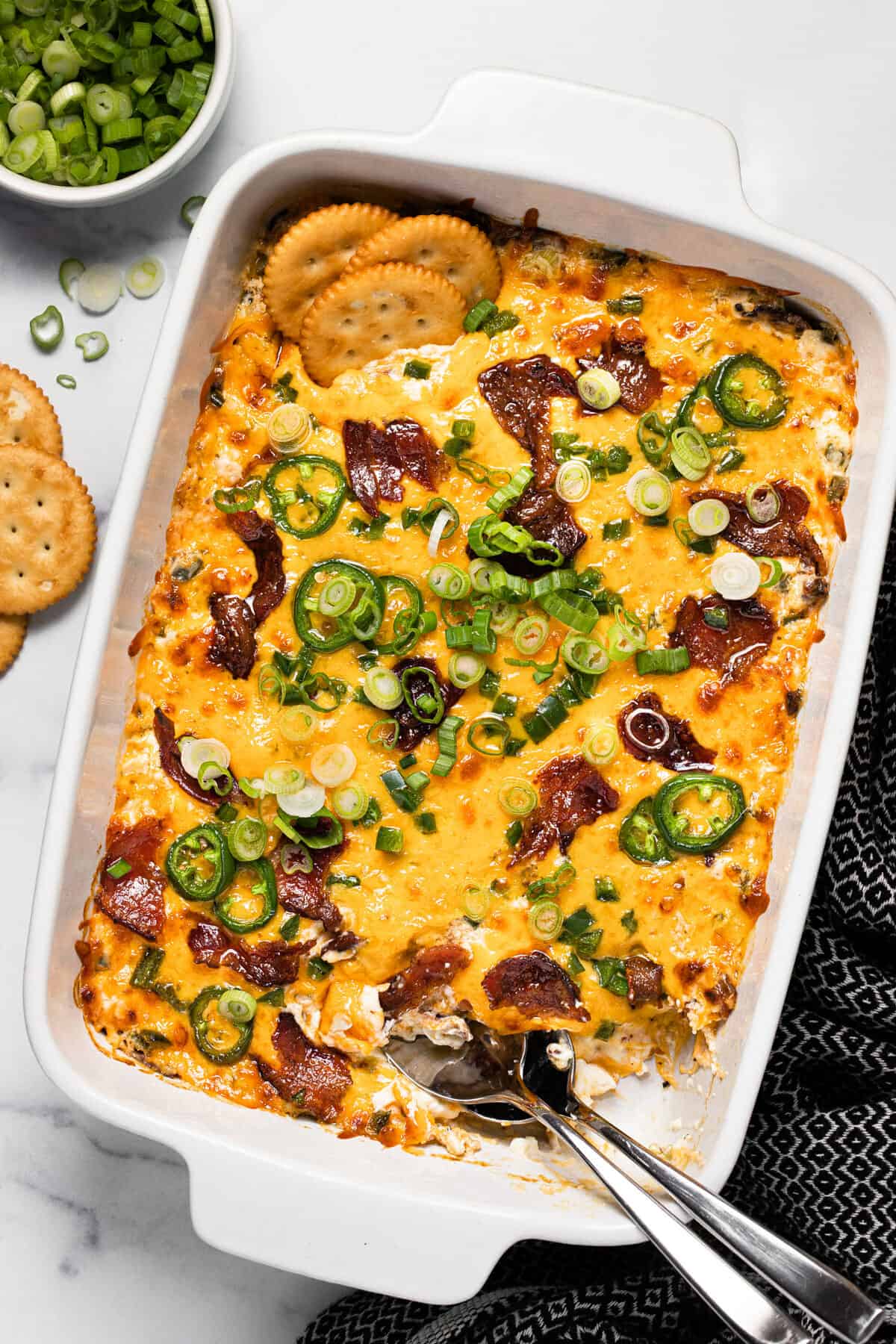 Large white baking dish filled with homemade jalapeno popper dip