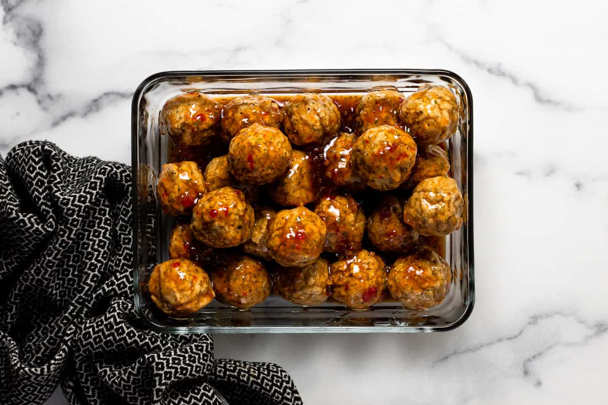 Chili lime meatballs in a Pyrex glass baking dish 