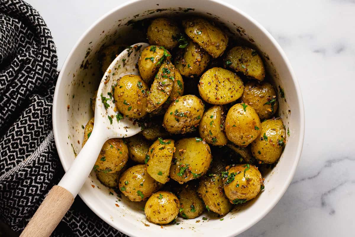 Herby roasted potatoes tossed in an herby olive oil mixture