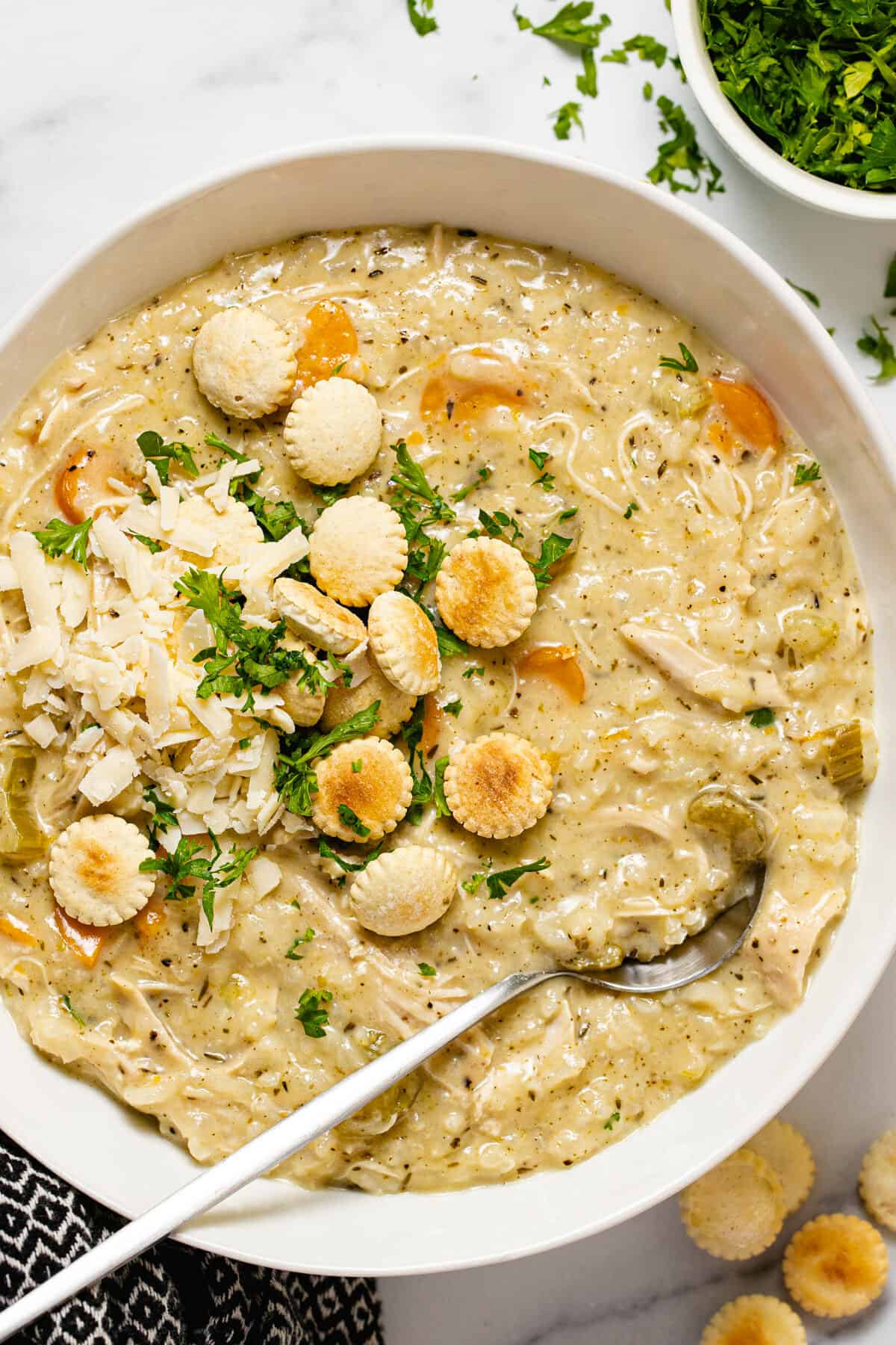 Large white bowl filled with creamy instant pot chicken and rice soup