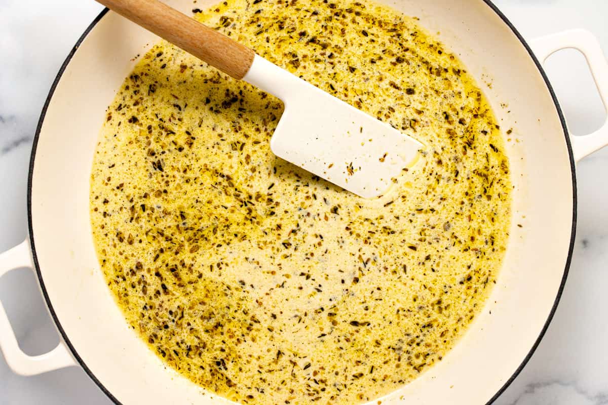Lemony herb garlic cream sauce for salmon with pasta.