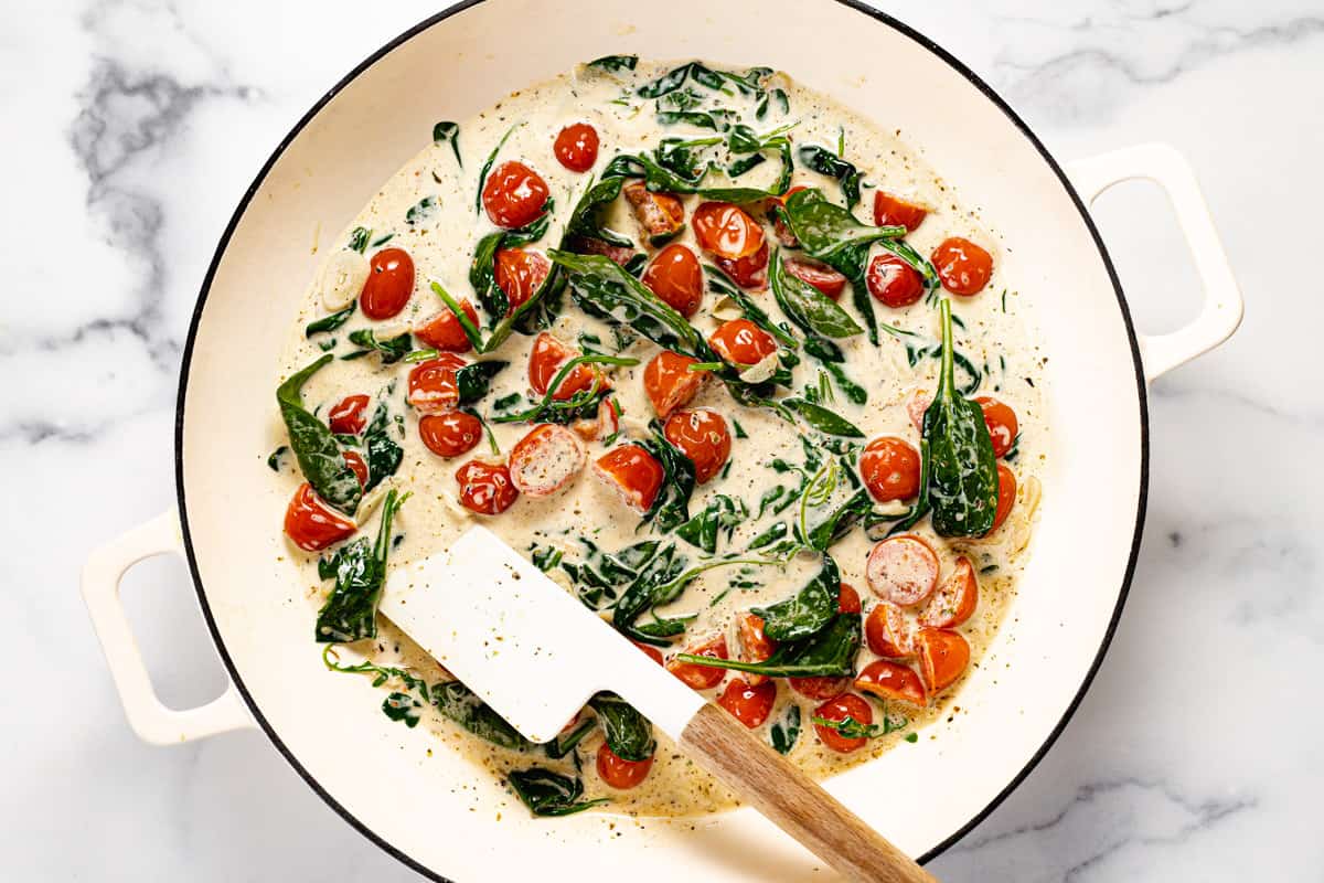 Tomatoes and fresh spinach wilted in a garlic cream sauce