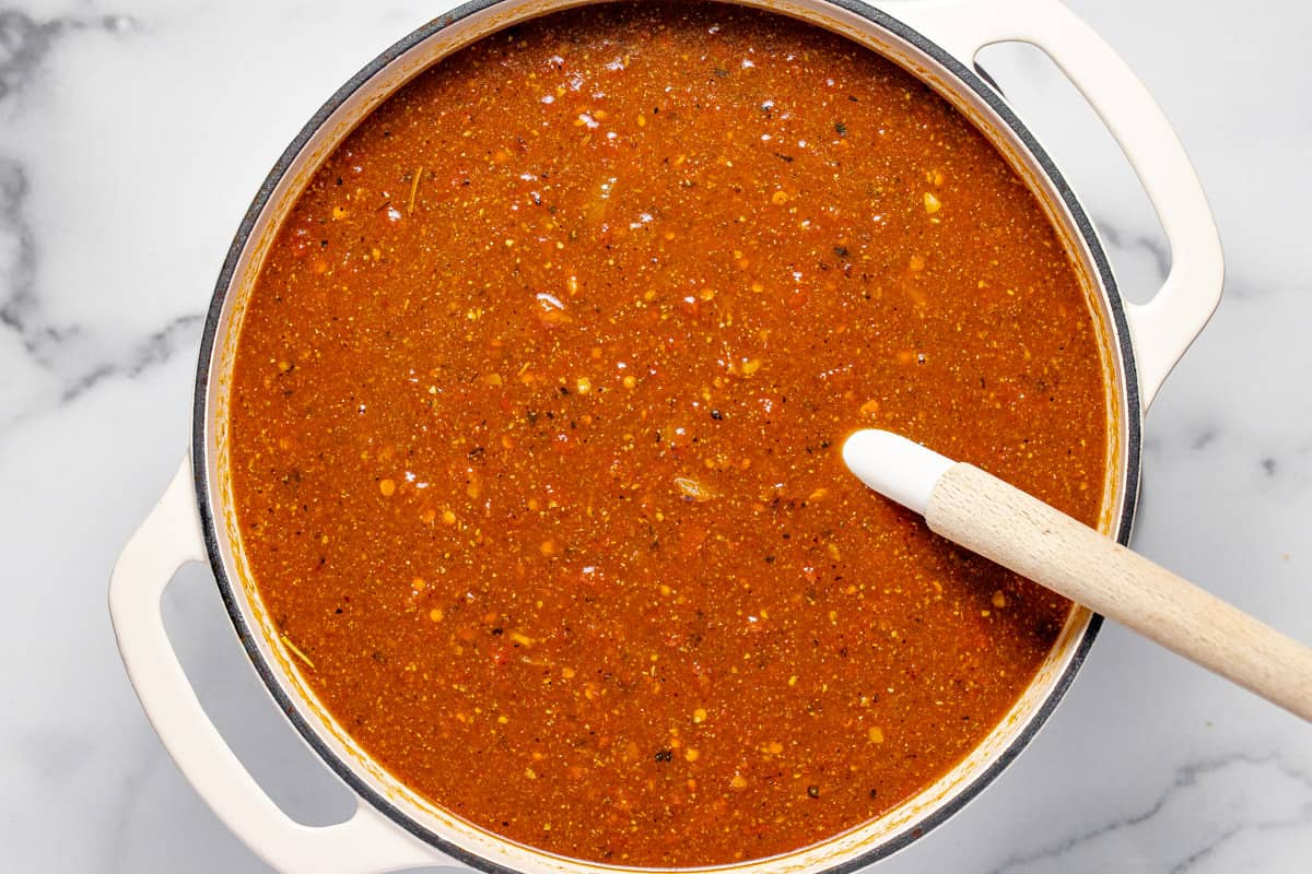 Large pot with ingredients to make lasagna soup