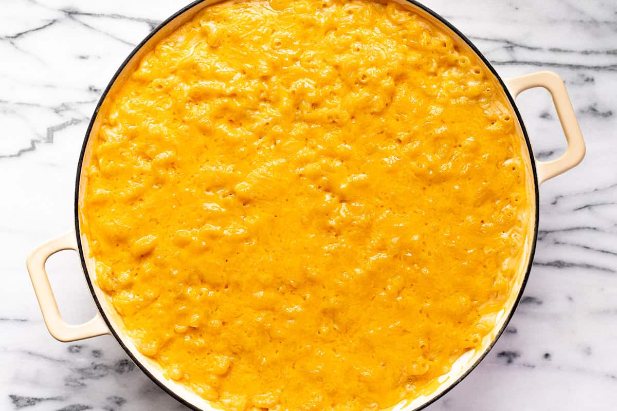 Freshly made smoked macaroni and cheese topped with melted cheddar cheese