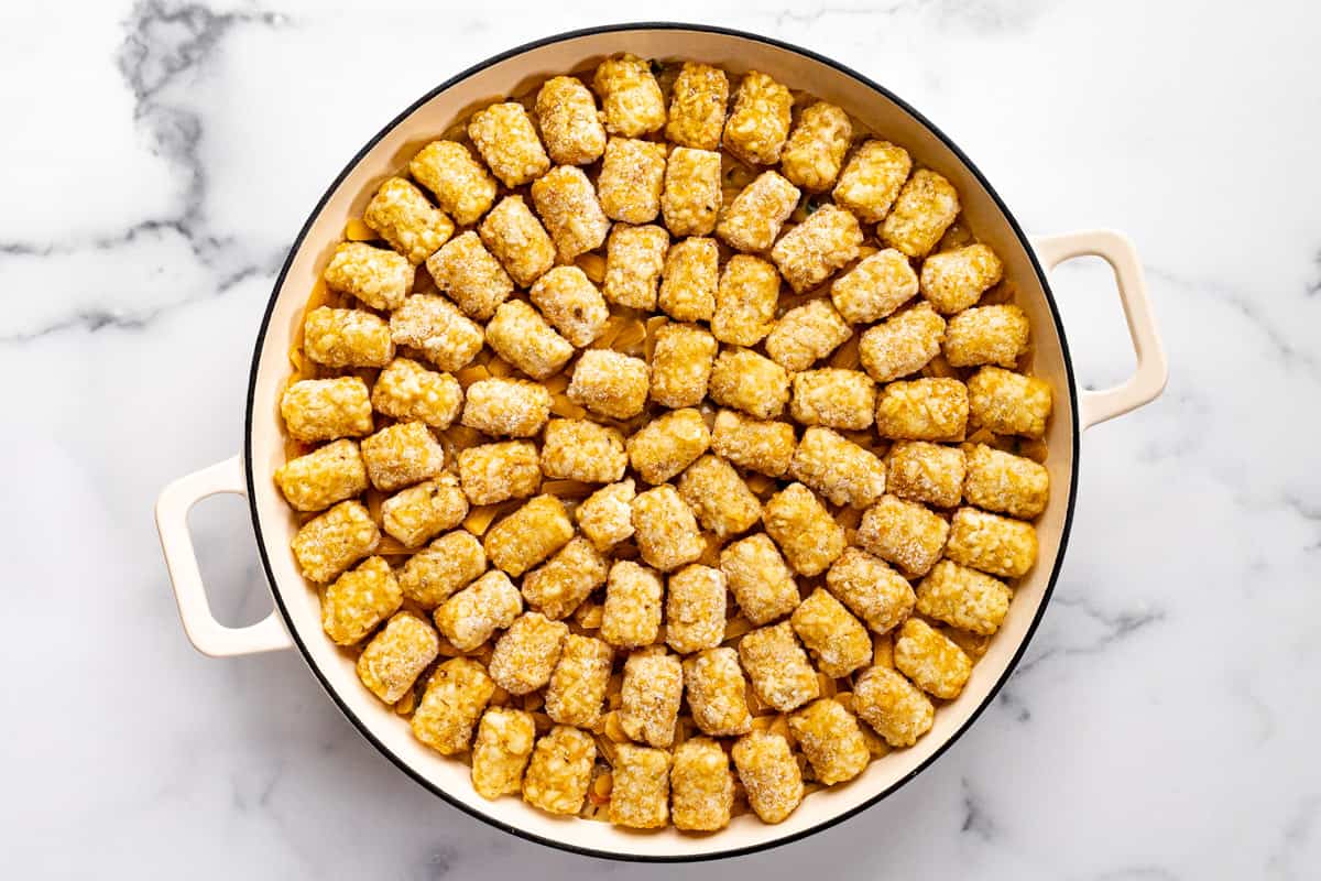 Large white pan filled with homemade tater tot casserole