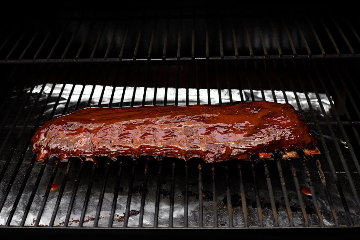 BBQ smoked baby back ribs on a wood pellet grill.