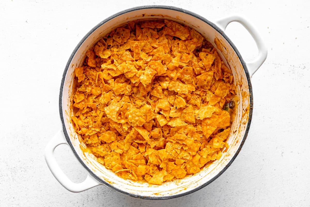 Large white pan filled with homemade Doritos casserole.