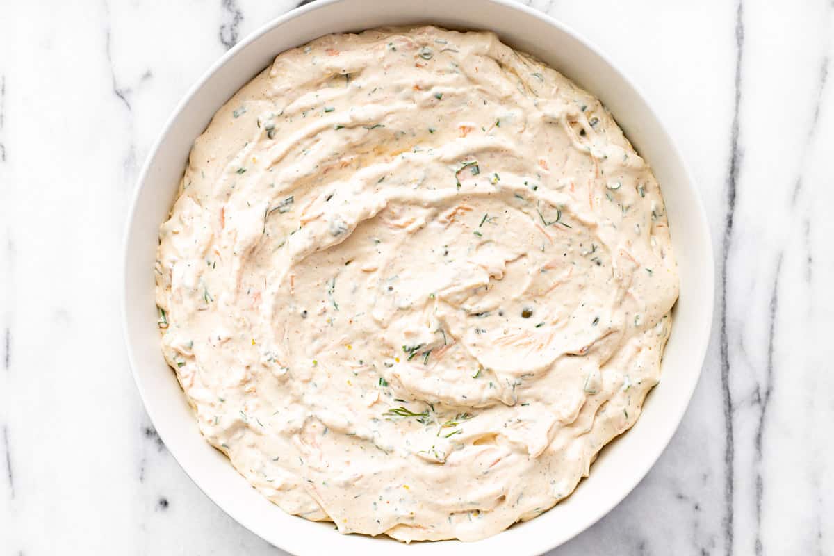White bowl filled with homemade creamy smoked salmon dip.