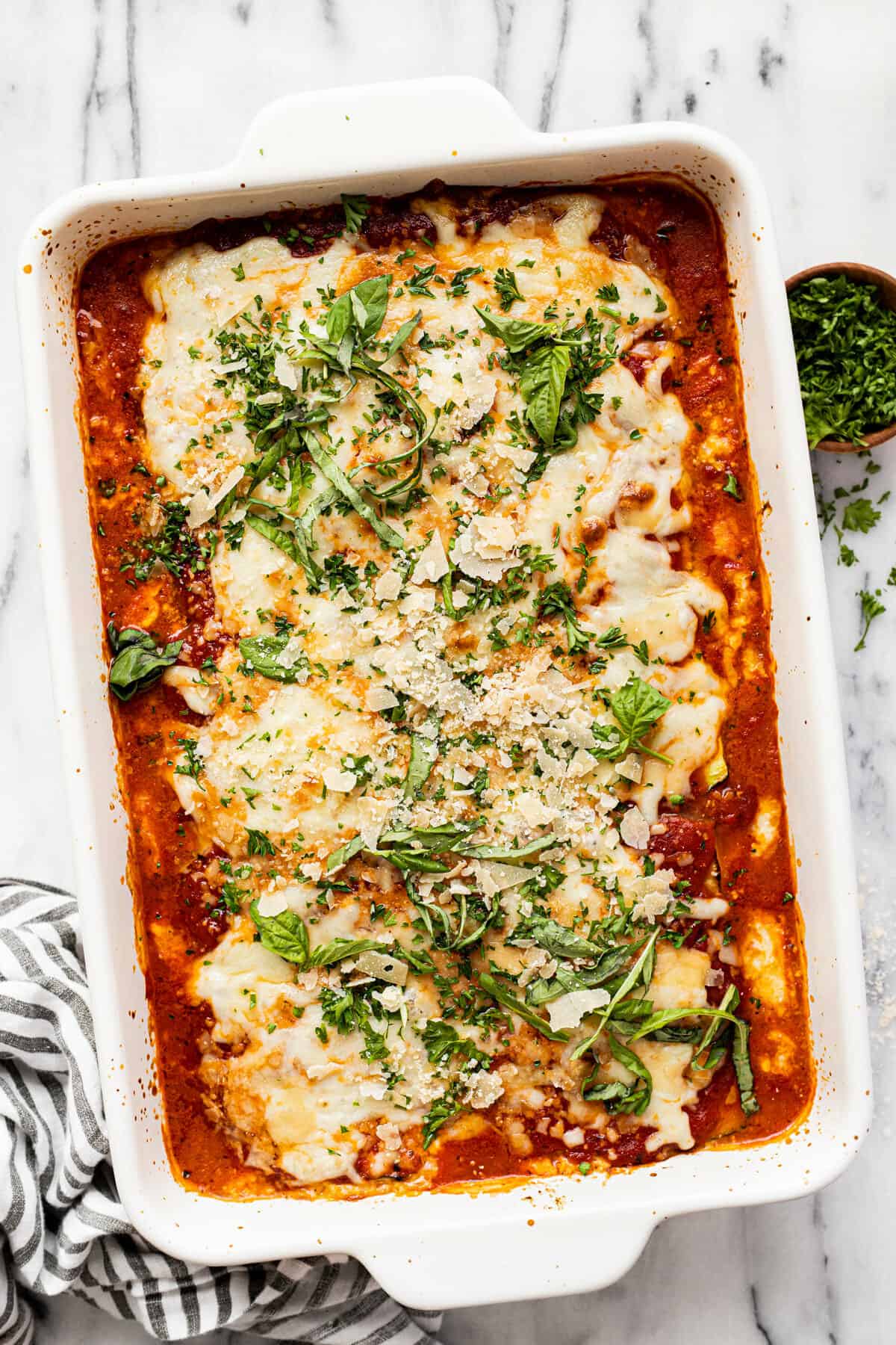 Large white pan filled with homemade zucchini lasagna.