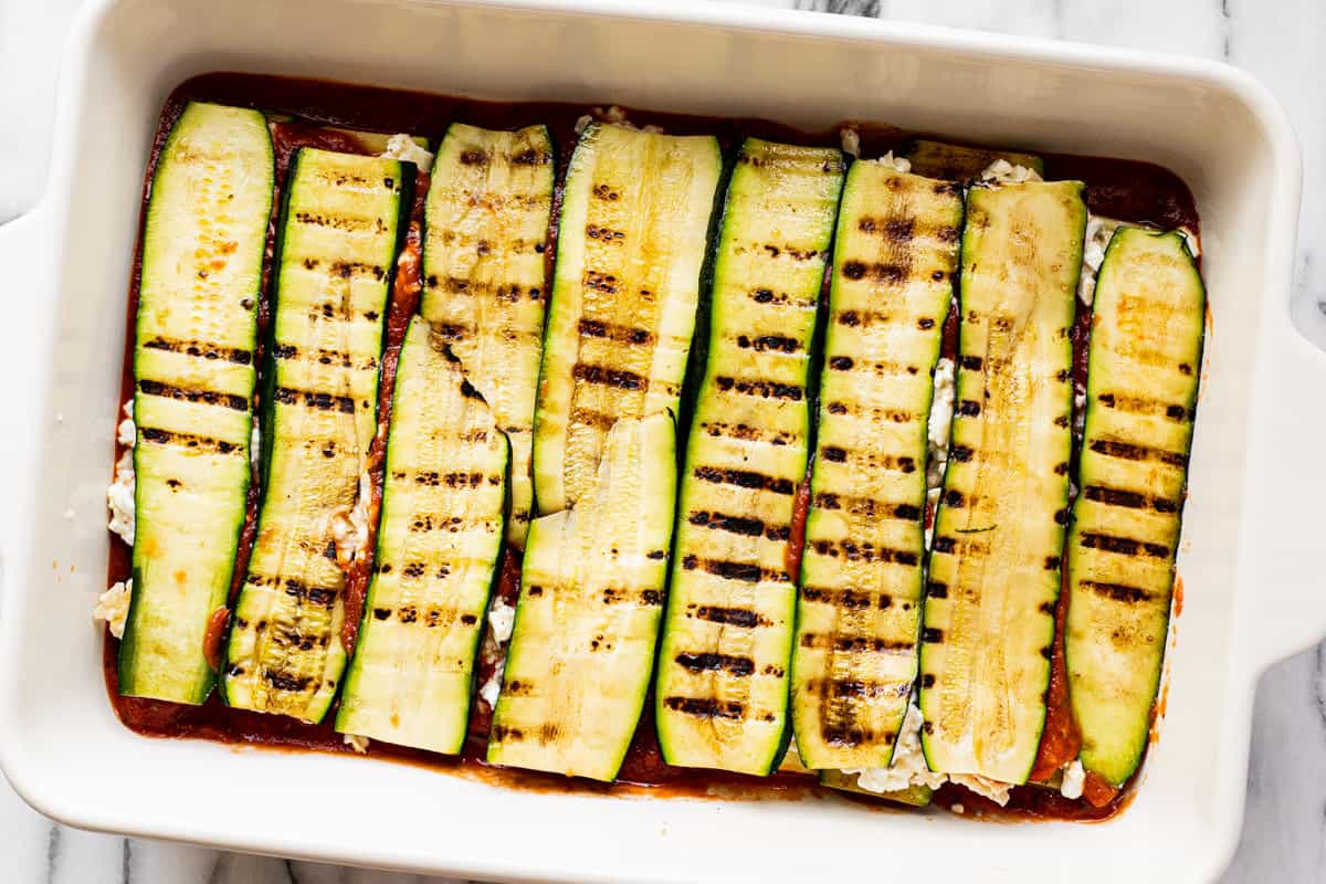 Step by step photos showing how to make homemade zucchini lasagna.