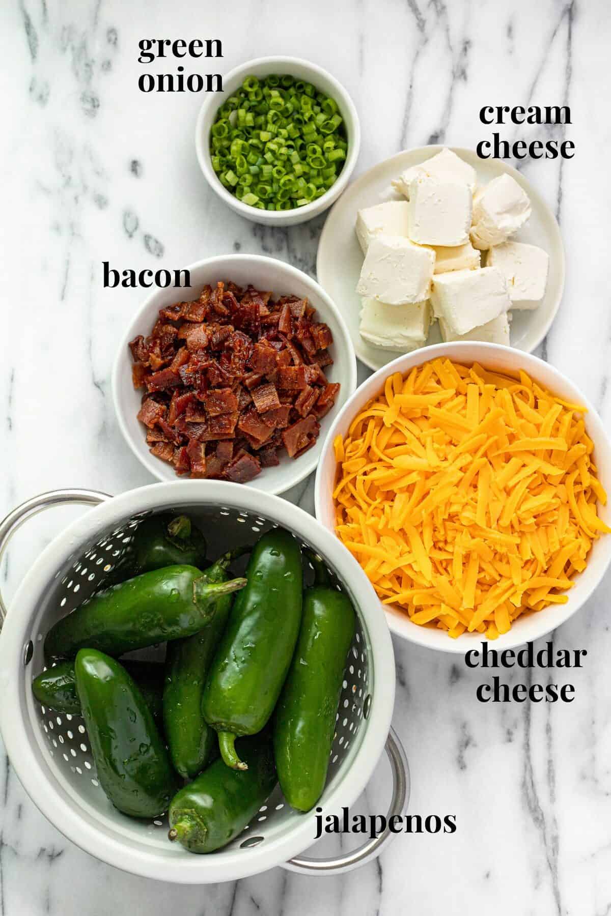 Bowls of ingredients to make smoked jalapeno poppers.