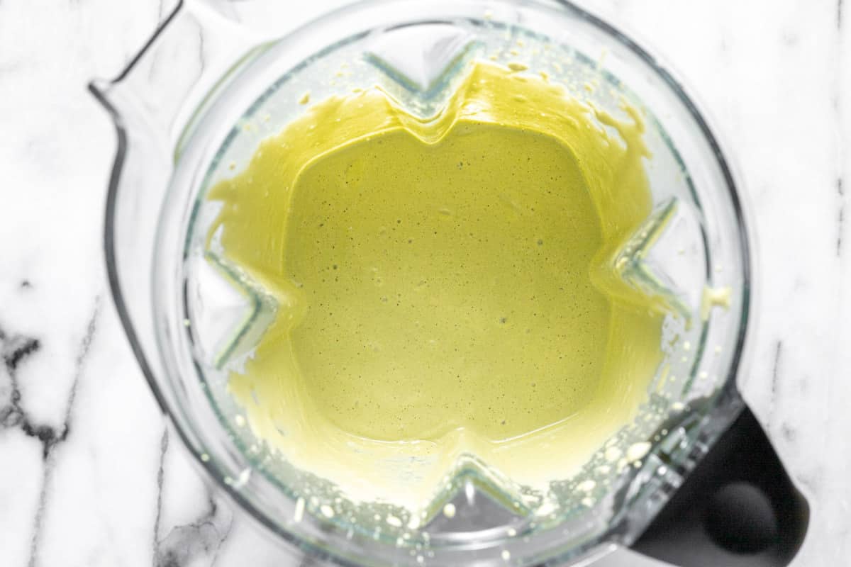 Homemade creamy cilantro lime sauce in a high speed blender.
