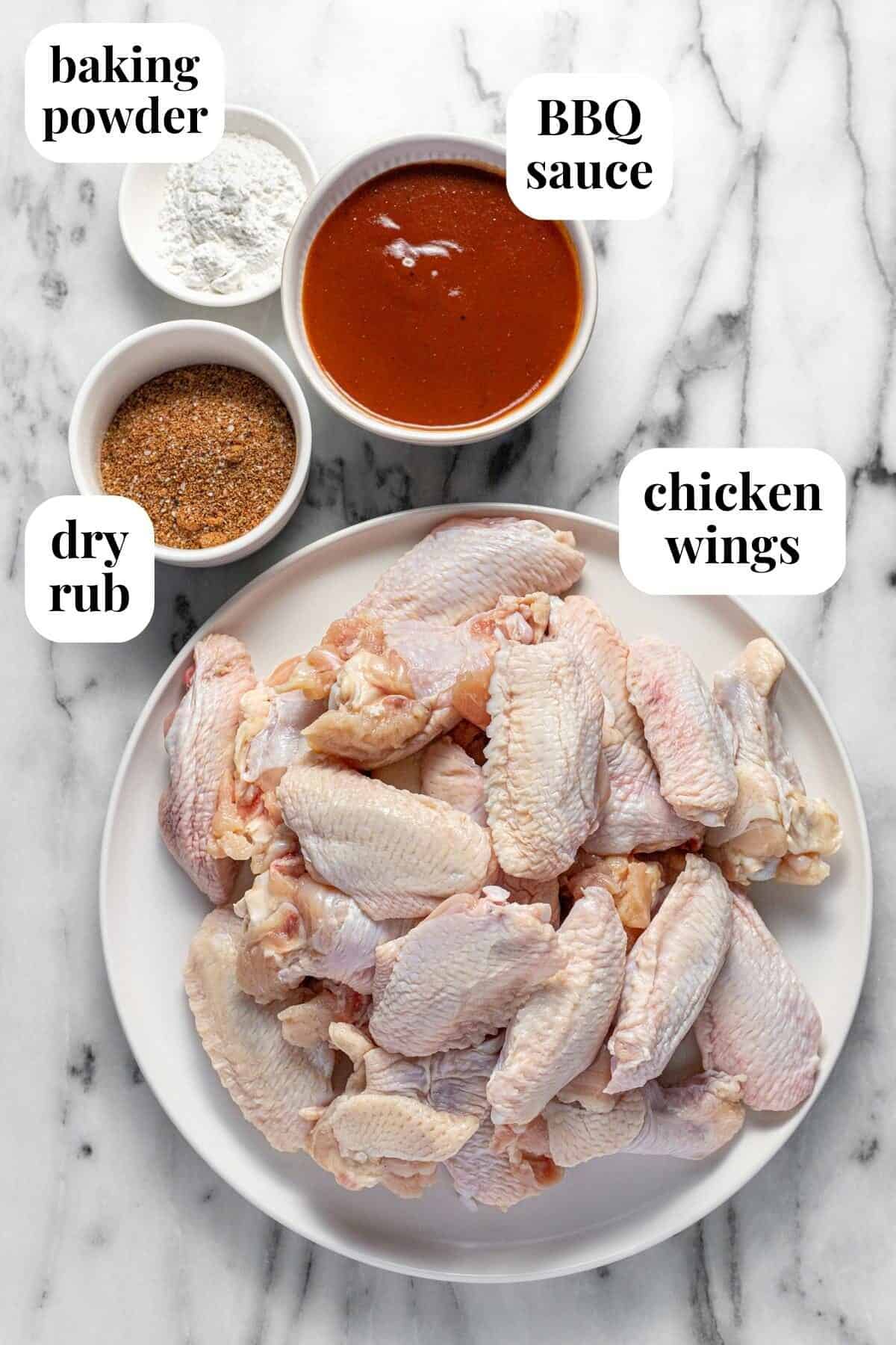 White bowls of ingredients to make smoked chicken wings.