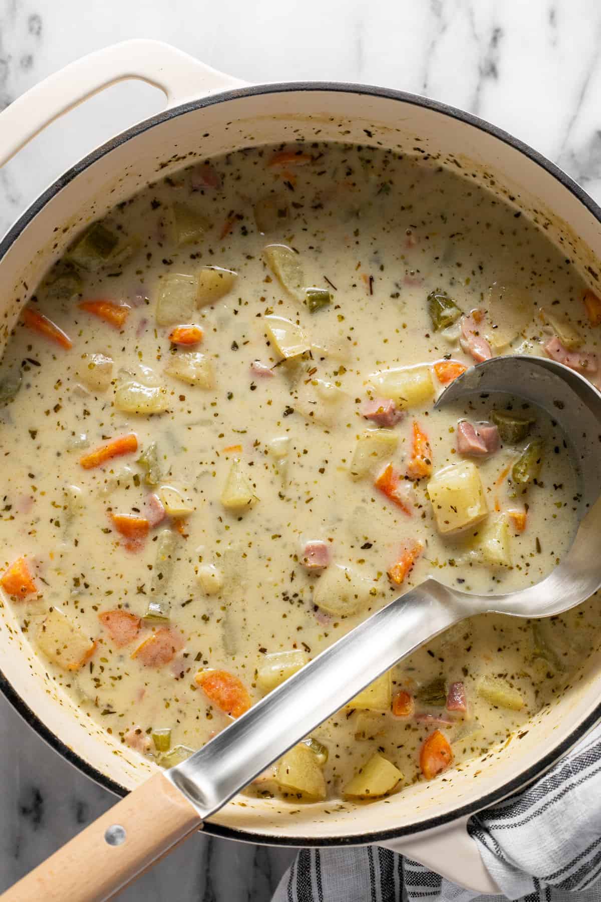 Large pot filled with creamy homemade  ham and potato soup.