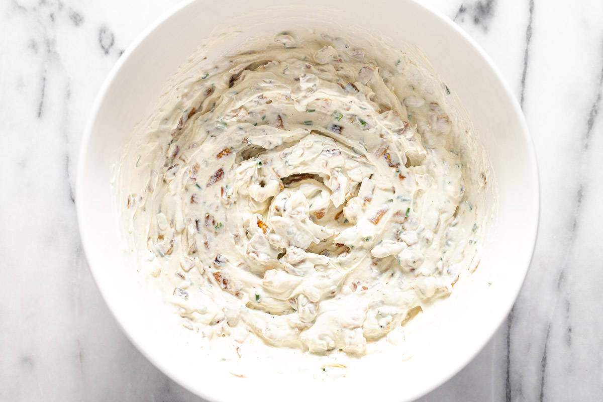 Bowl filled with homemade French onion dip. 