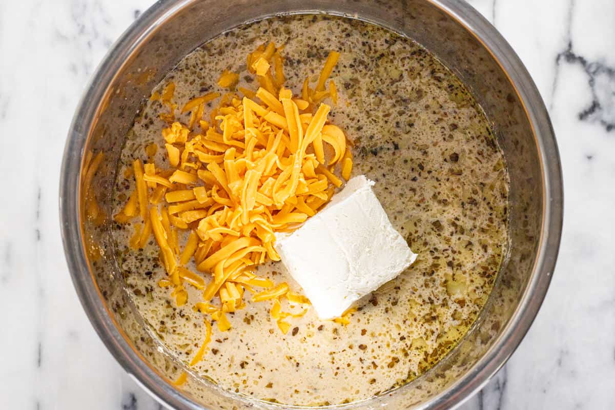 Instant pot potato soup with shredded cheddar and cream cheese. 