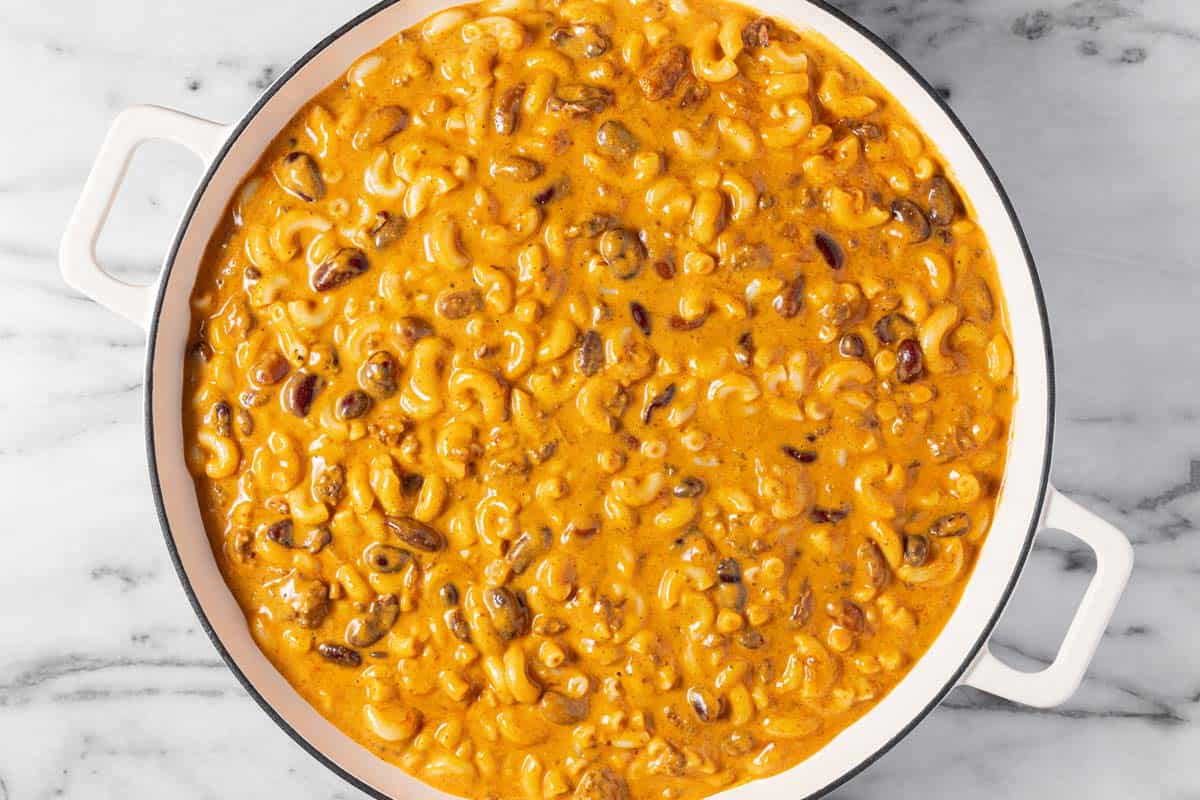 A large pan filled with cheesy chili mac. 