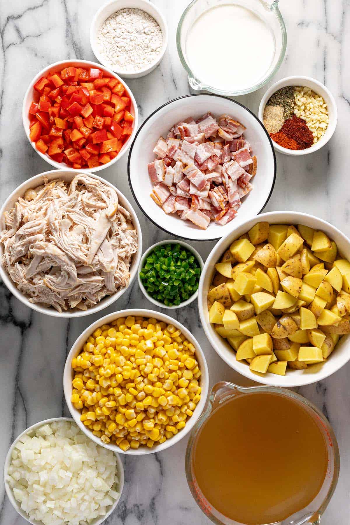 Bowls of ingredients to make creamy one pot chicken corn chowder. 