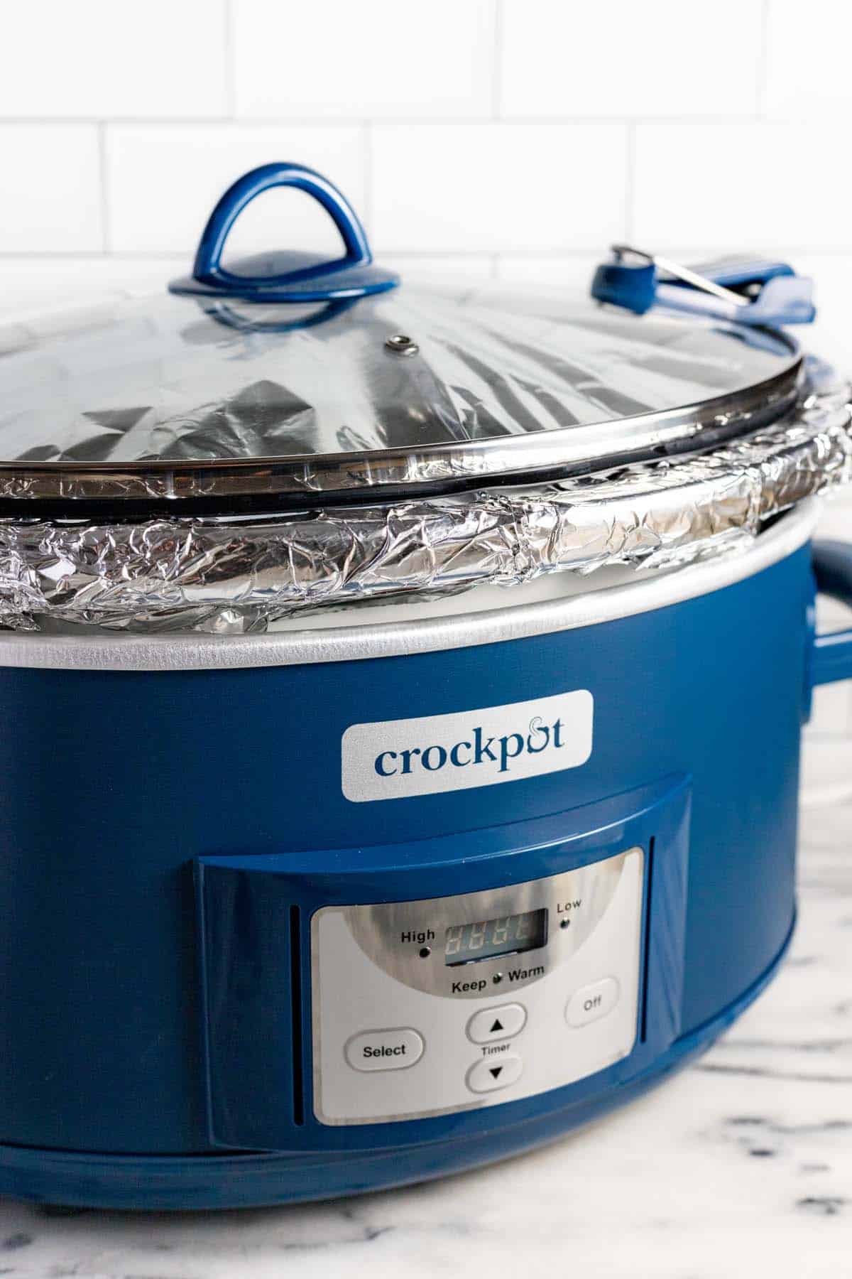 Large crock pot covered with tin foil and the lid. 