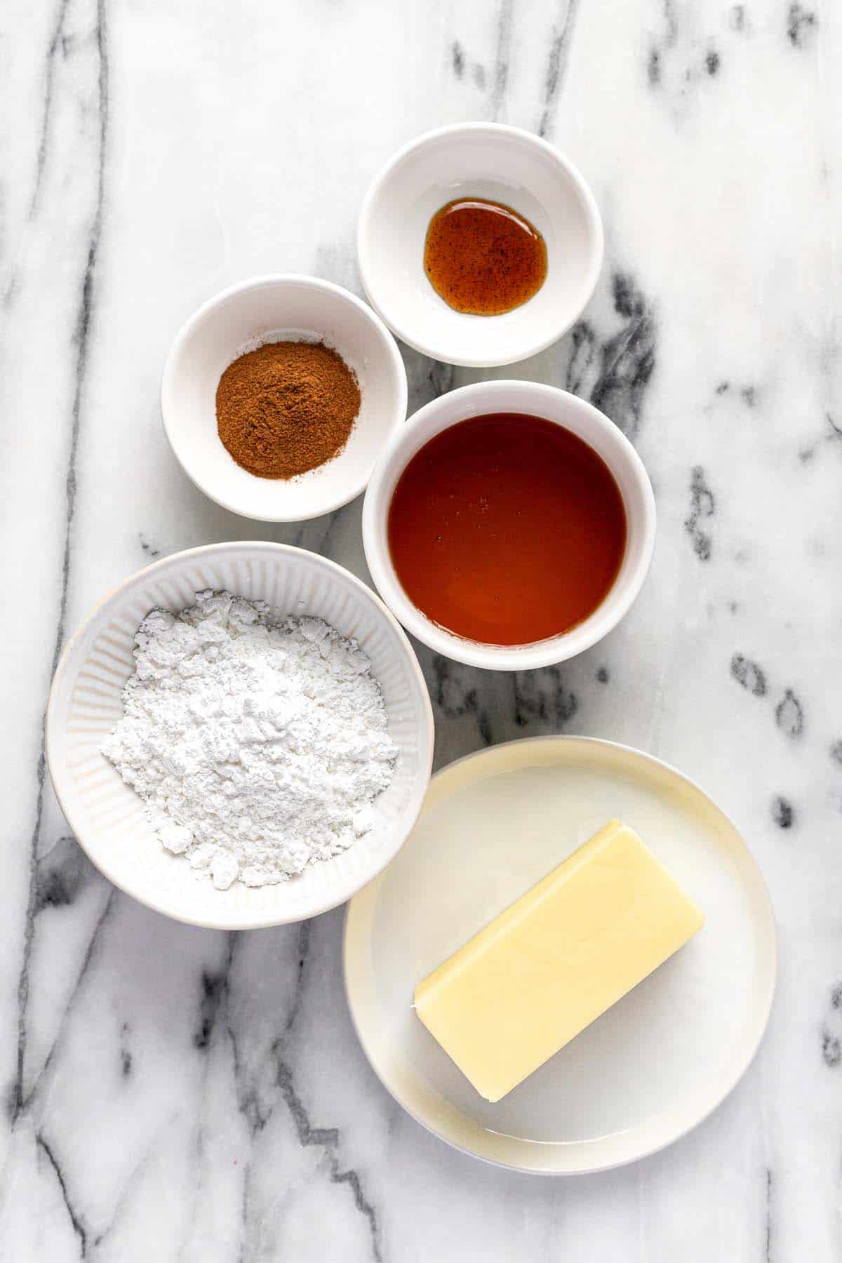 Bowls of ingredients to make creamy cinnamon butter. 