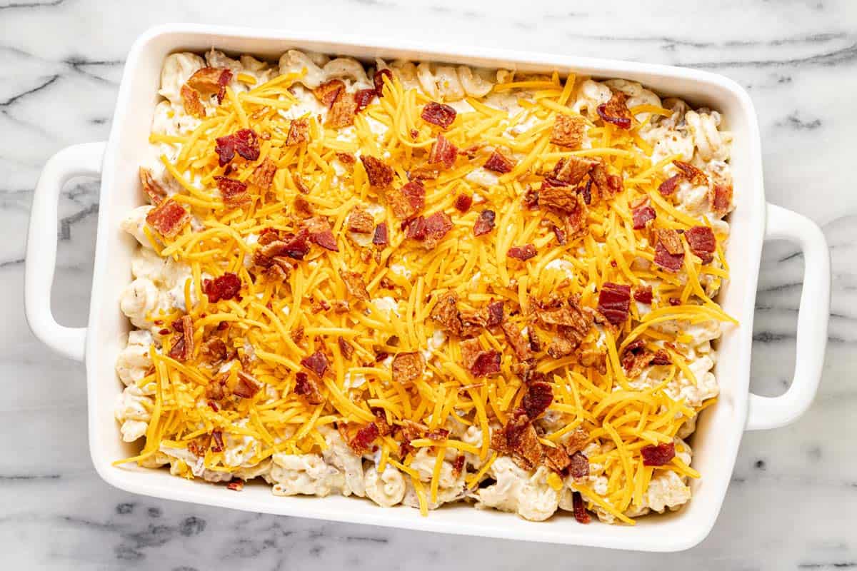 Large baking dish filled with chicken bacon ranch casserole ready to go in the oven. 