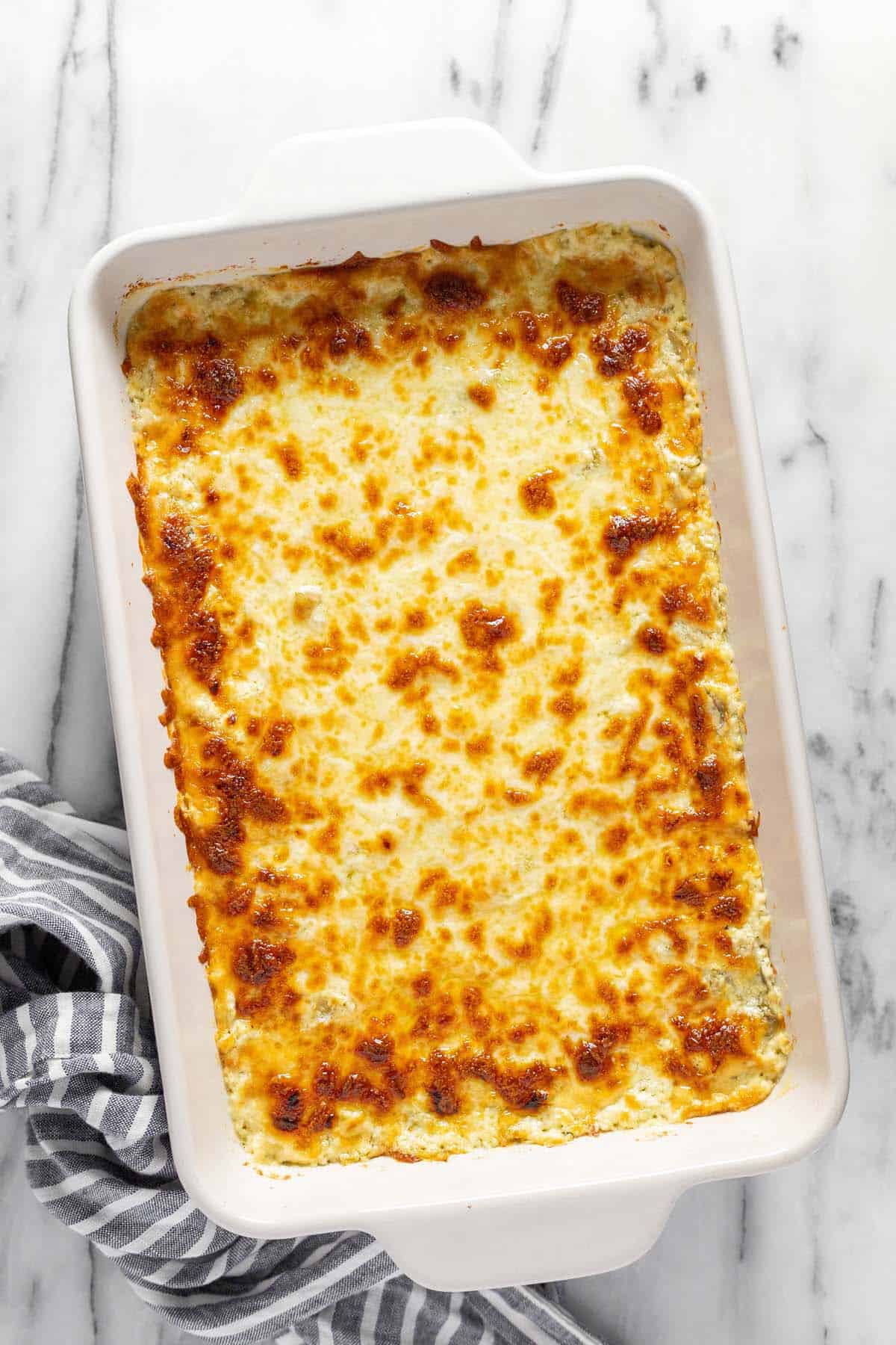 Baked feta dip in a large baking dish. 