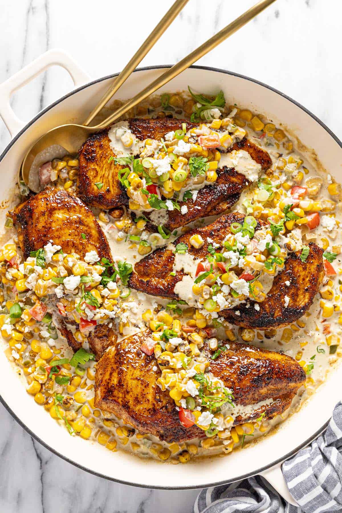 Large pan filled with street corn chicken with a cream sauce.  