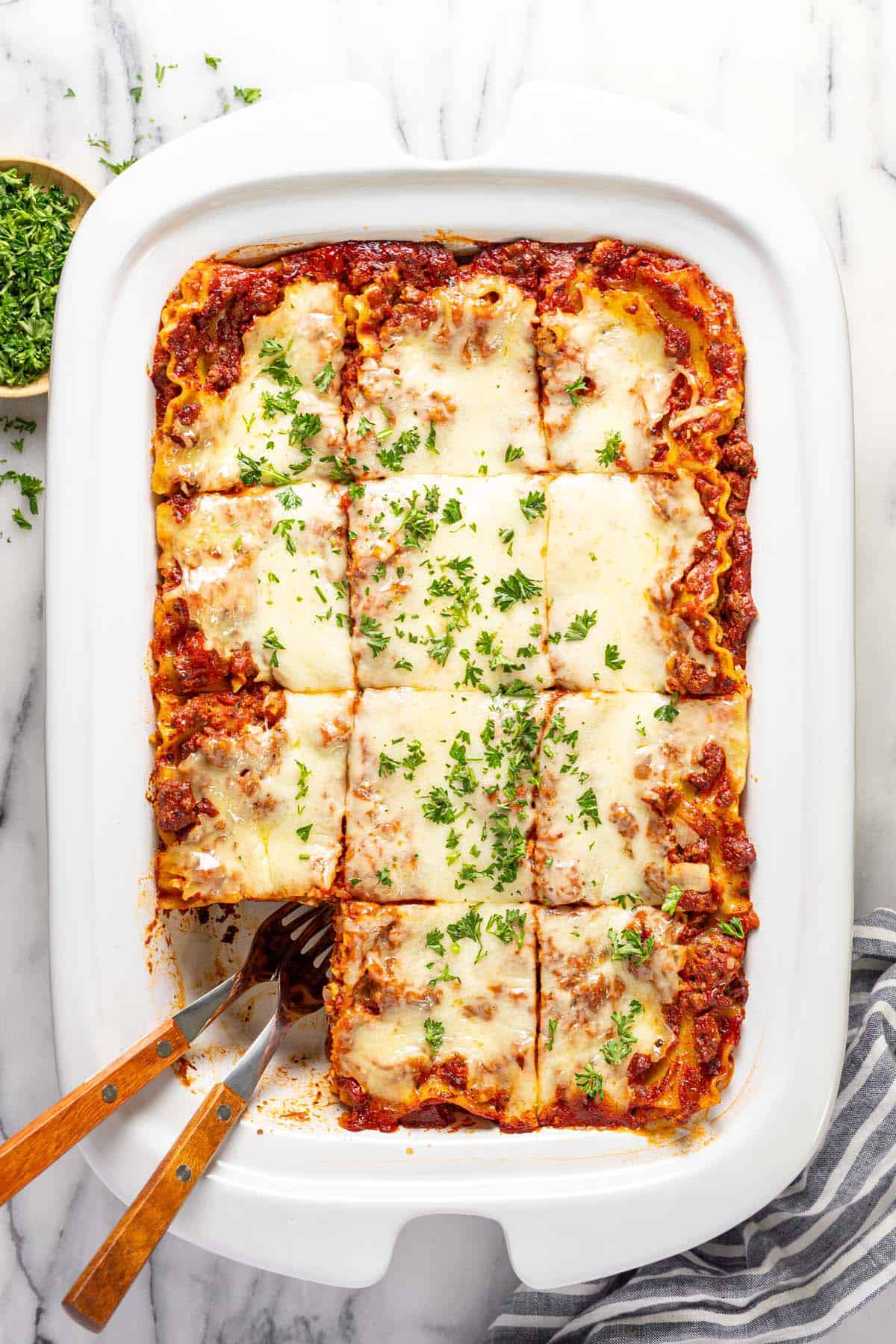 Large crock pot filled with homemade meat lasagna. 