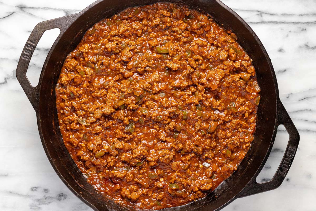 Homemade sloppy joe mixture in a cast iron pan. 