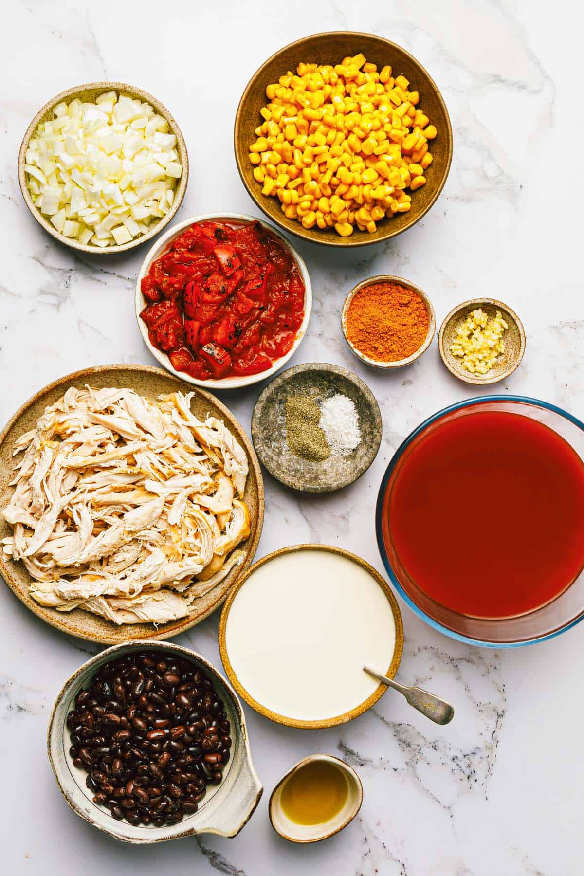 Bowls of ingredients to make chicken taco soup!