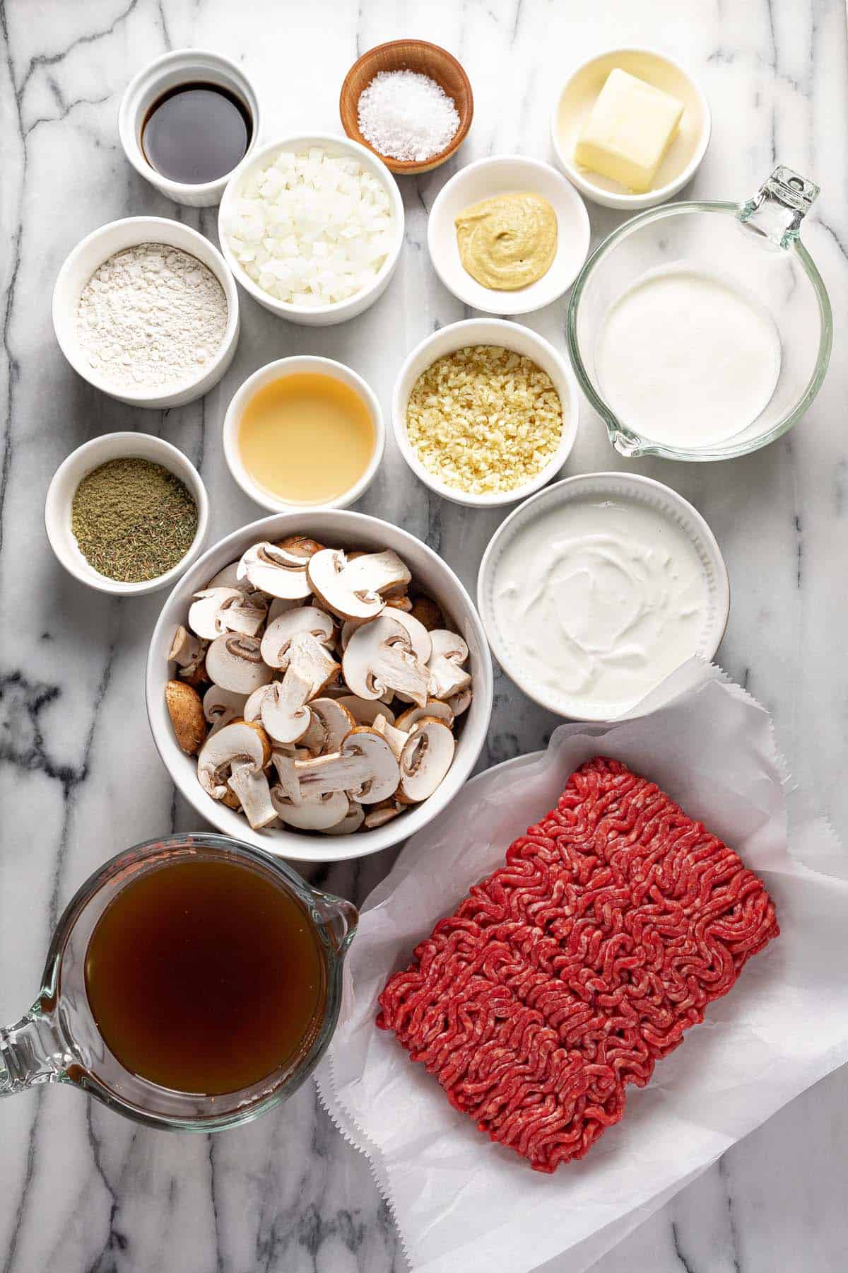 Bowls of ingredients to make ground beef stroganoff. 