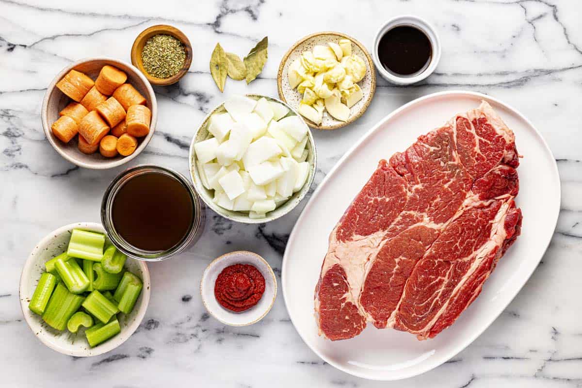 Bowls of ingredients to make braised beef chuck roast. 